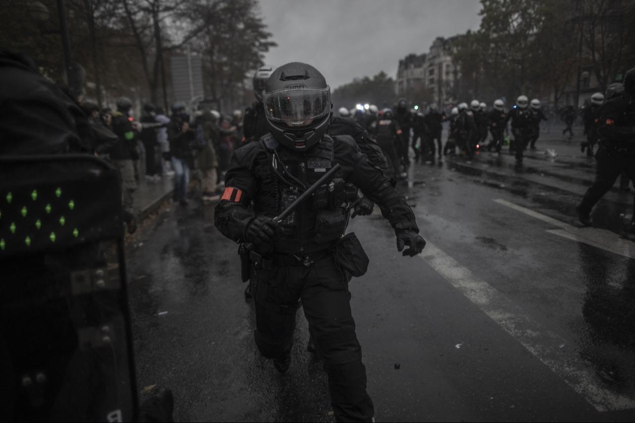 Demonstrators clash with riot police, who fire tear gas grenades and deploy water cannon to disperse protesters during a demonstration in Paris, France, on Oct. 24, 2026, against the rising cost of living and poor conditions in the education system. (AA Photo)