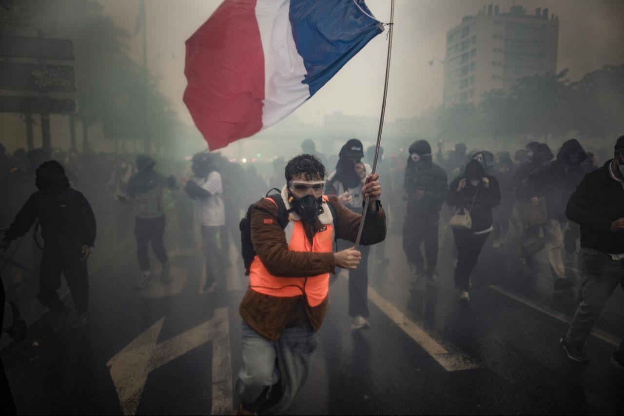 Demonstrators clash with riot police, who fire tear gas grenades and deploy water cannons to disperse protesters during a demonstration in Paris, France, on October 24, 2026. (AA Photo)