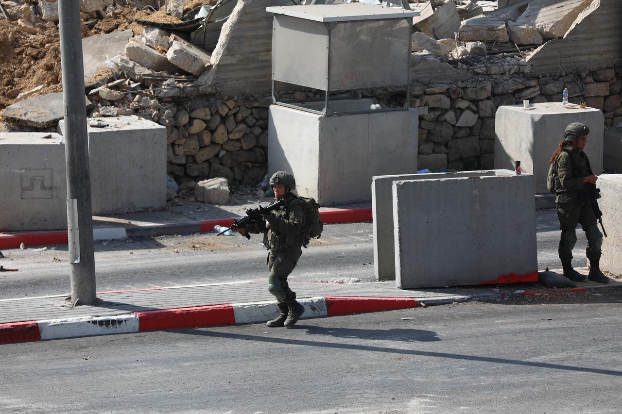 Israeli forces take security measures at the Farsh Al Hawa military checkpoint, where Palestinian homes and structures have been demolished by Israeli army heavy machinery in Hebron, West Bank, Palestine, Oct. 24, 2026. (AA Photo)