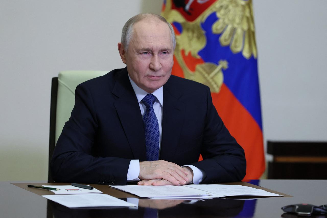 Russian President Vladimir Putin sits at a desk with documents in front of him in Russia, Oct. 23, 2026. (AFP Photo)