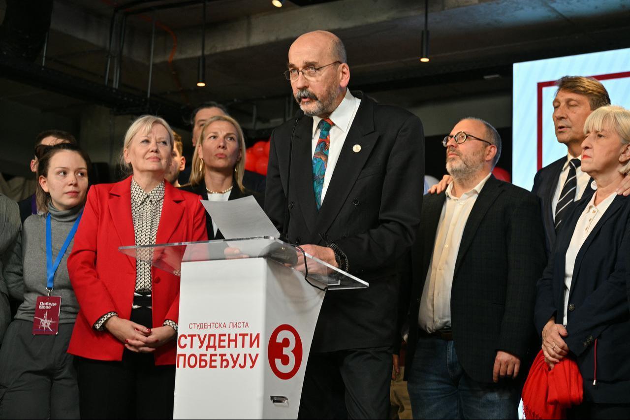Radomir Saicic, a chemistry professor and candidate on the student-backed electoral list (C), speaks on stage at the Students’ List headquarters in Belgrade on Oct. 25, 2026. (AFP Photo)