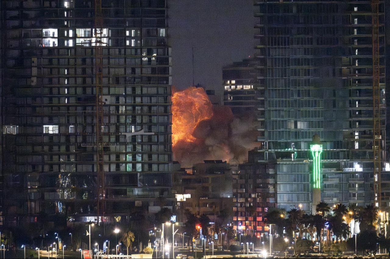 Smoke and flame rise after Iranian strikes hit a building as Iran's ongoing retaliatory attacks with ballistic missiles towards Israel are seen from Tel Aviv, Israel on June 16, 2025. (AA Photo)