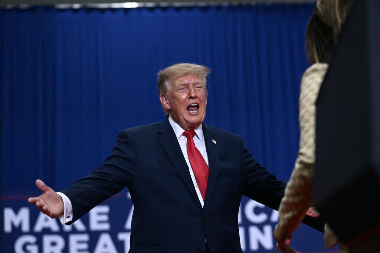 US President Donald Trump welcomes rapper Nicki Minaj on stage during a campaign rally at the McMorran Place Sports & Entertainment Center in Port Huron, Michigan, on Oct. 25, 2026. (AFP Photo)