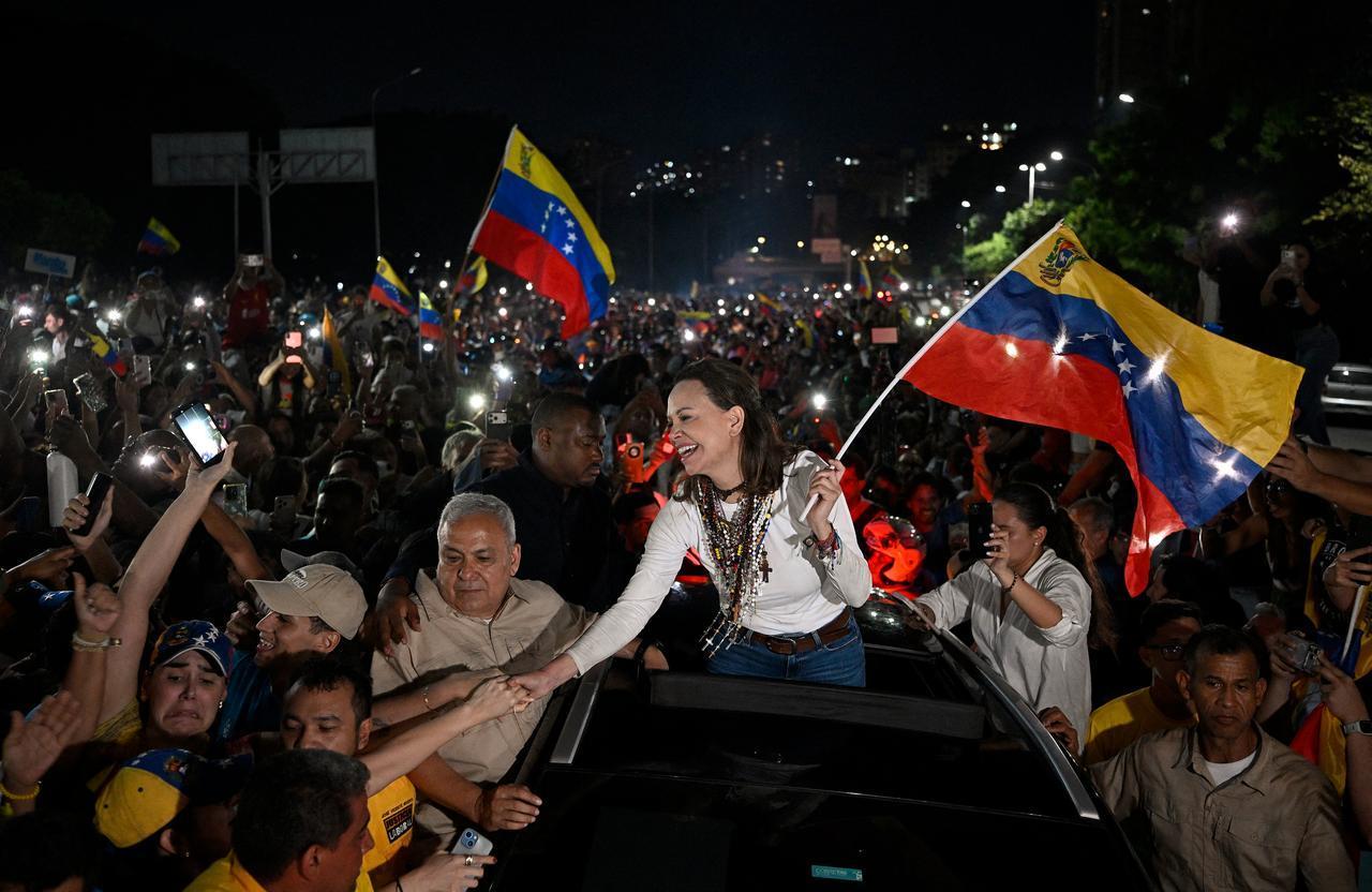 Venezuelan opposition leader and Nobel Peace Prize laureate Maria Corina Machado greets supporters upon her arrival in Caracas on Oct. 25, 2026. (AFP Photo)
