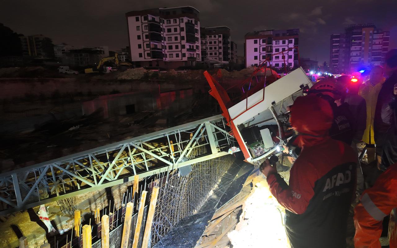 Emergency personnel inspect the wreckage of a crane toppled by a tornado at a construction site in Antalya, southern Türkiye, on Oct. 26, 2026. (AA Photo)