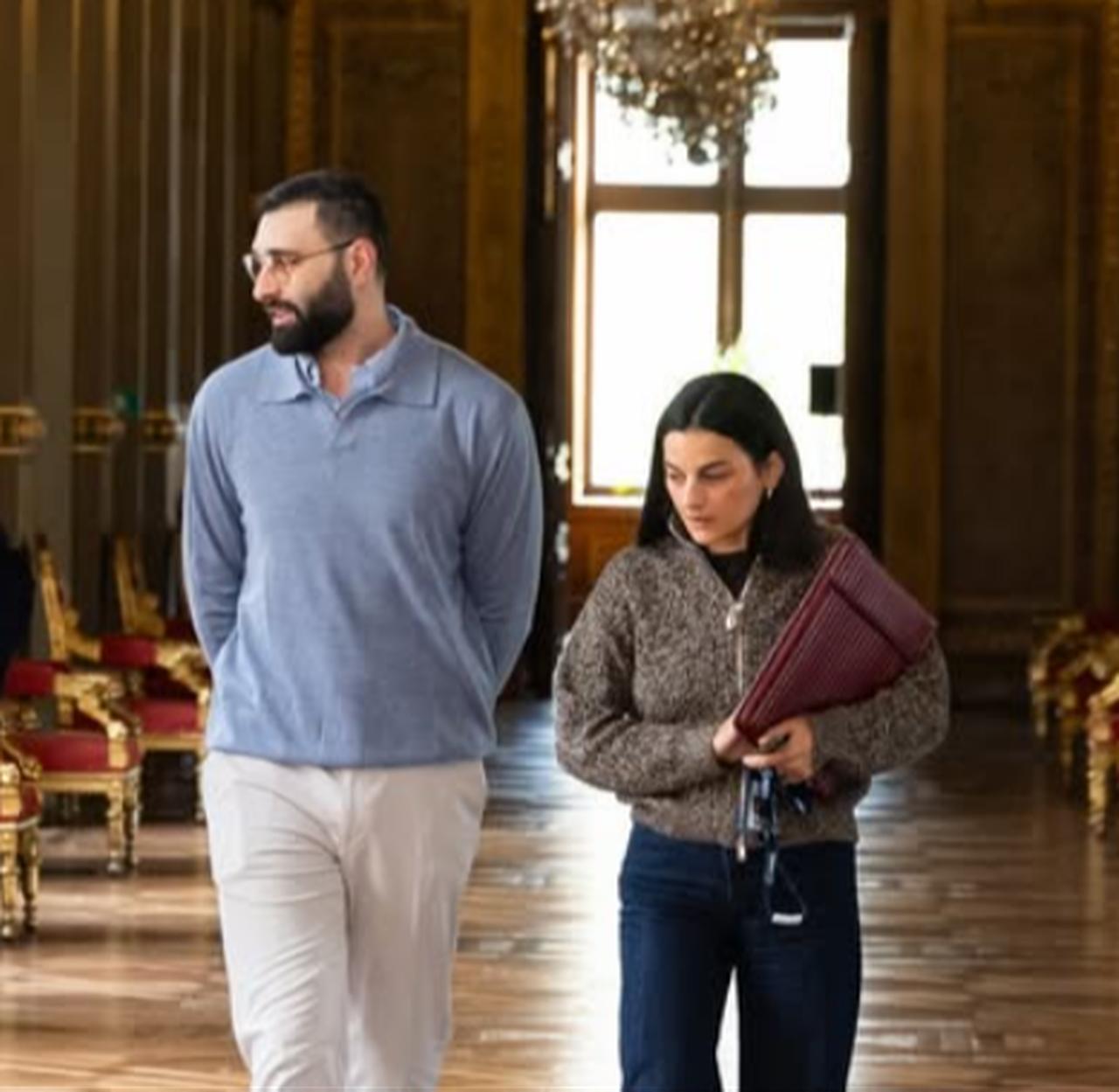 Photojournalist Motaz Azaiza walks through the grand hallway of Paris City Hall during his visit for talks on Gaza and Palestine. (Photo via Instagram /@motaz_azaiza)