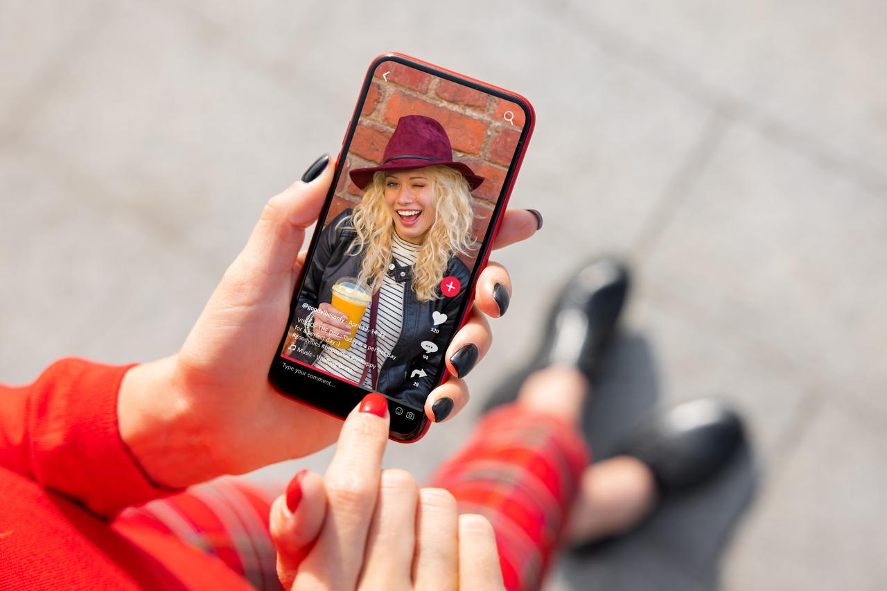 A person watches a short-form video on a smartphone. (Adobe Stock Photo)