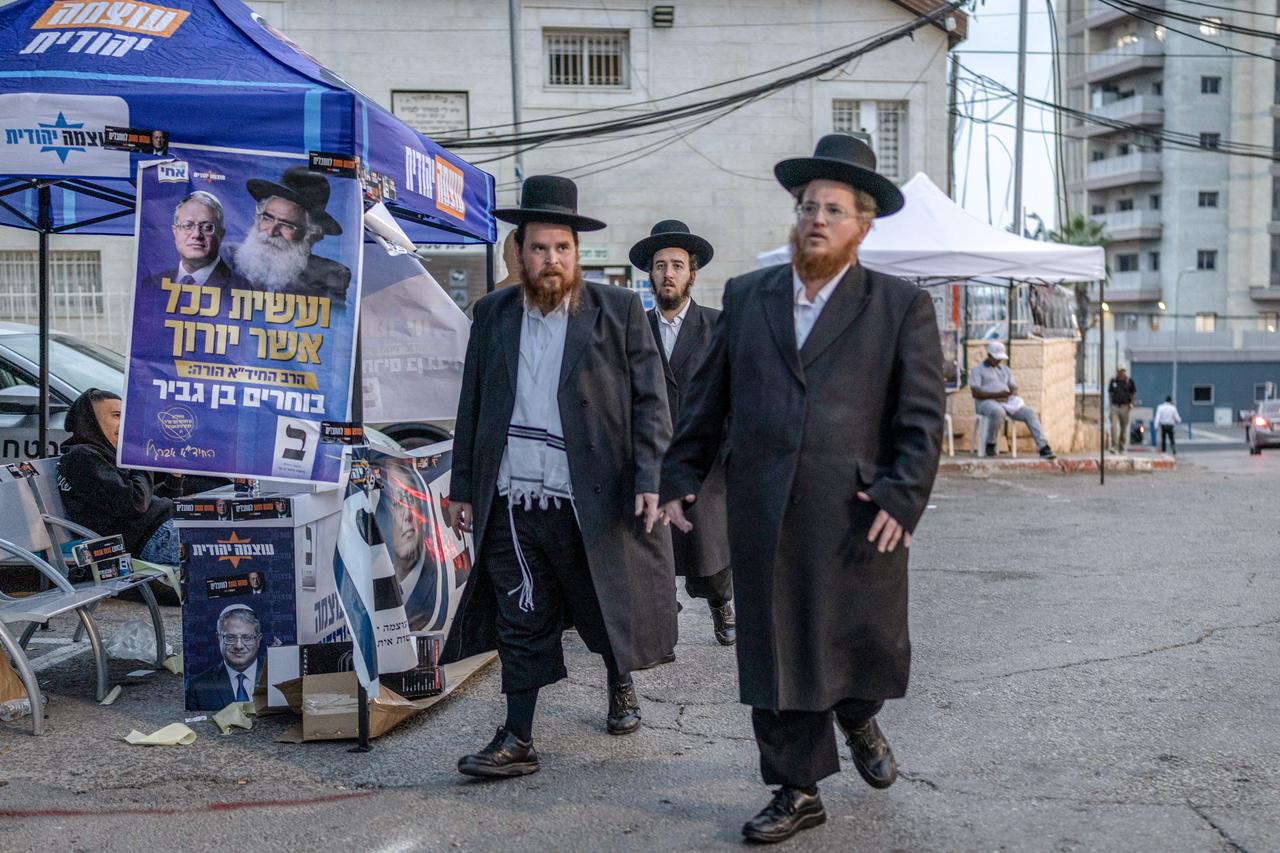 Ultra-Orthodox Jewish men walk outside a polling station in Bet Shemesh in central Israel on Oct. 27, 2026. (AFP Photo)