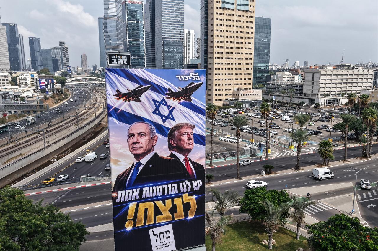 An aerial view shows a campaign billboard depicting Prime Minister Benjamin Netanyahu of the Likud party and US President Donald Trump in Tel Aviv on October 26, 2026. (AFP Photo)