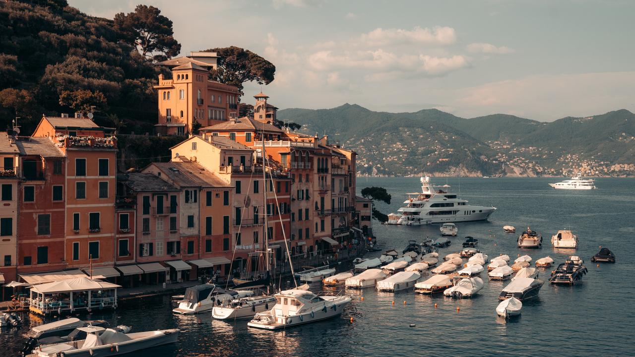 Colorful waterfront buildings and boats line the harbor in Portofino, Italy. (Adobe Stock Photo)