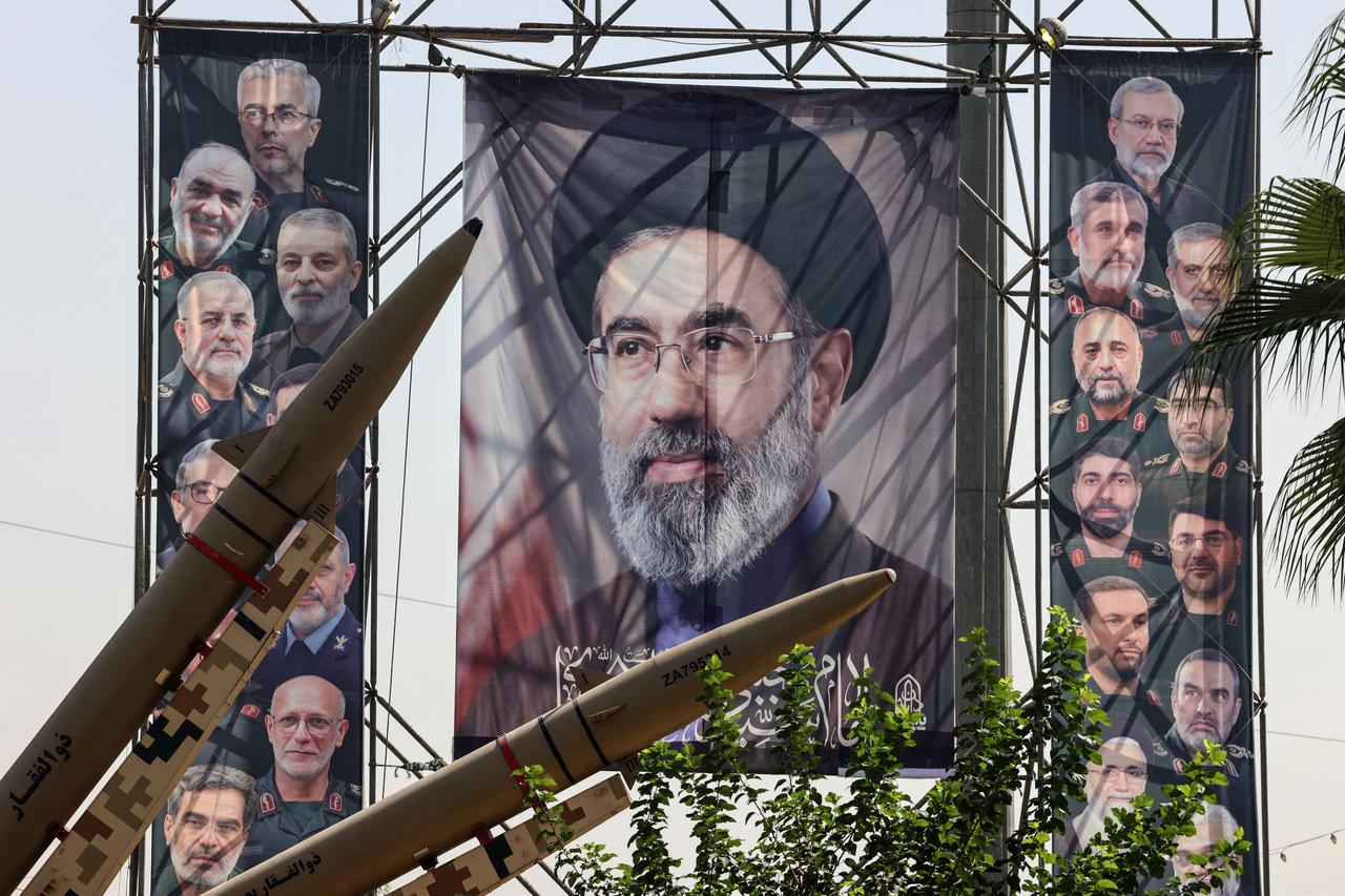 Iranian-made Zolfaghar missiles are seen on display beside a large portrait of Iran's supreme leader Mojtaba Khamenei at Baharestan Square in Tehran on Sept. 28, 2026. (AFP Photo)