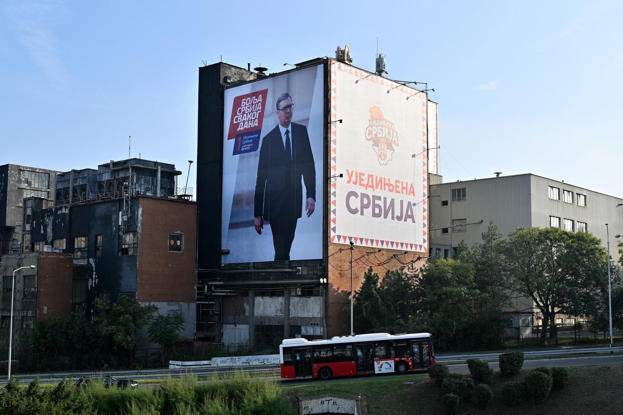 A giant election campaign billboard featuring an image of former Serbian president Aleksandar Vucic, the Serbian Progressive Party (SNS) candidate for prime minister, adorns a building in Belgrade on October 25, 2026, during the country's snap parliamentary elections. (AFP Photo)