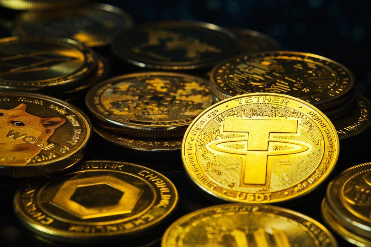 Close-up of gleaming cryptocurrency coins, featuring Tether at the forefront.(Adobe Stock Photo)