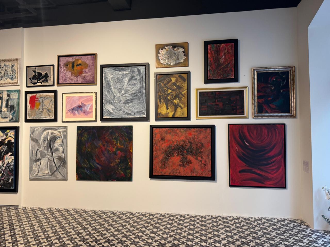 Works featuring geometric lines, stain techniques, and vibrant color compositions from the U+K Art Collection on display at The Muradiye gallery space in Karakoy. (AA Photo)