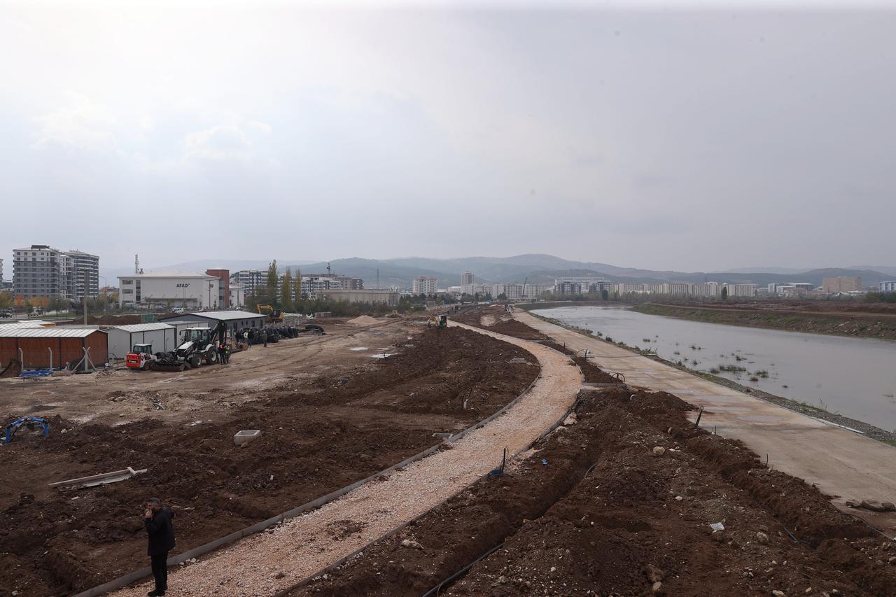 Heavy machinery and crews carry out landscaping and pathway construction along the Kizilirmak riverbank in Sivas. (AA Photo)