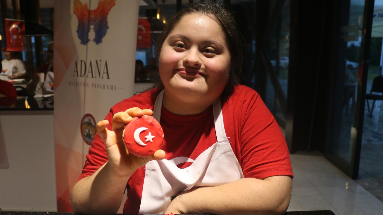 Tiny chefs in Adana shape dough into crescent-and-star cookies for Republic Day