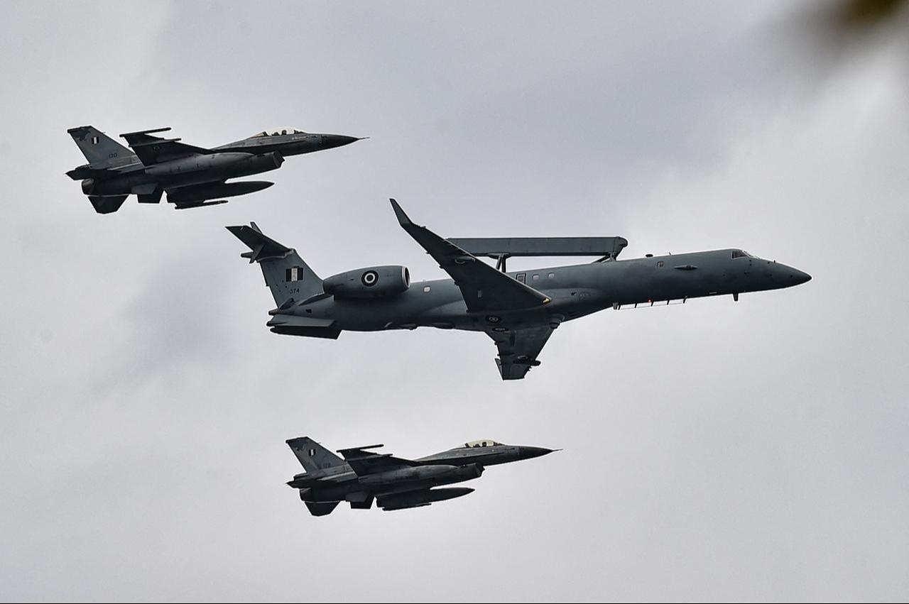 A Greek Air Force Embraer R-99 military aircraft flies with two F-16 fighter jets  during a military parade to mark the national "Oxi" (No) Day in Thessaloniki on Oct. 28, 2026. (AFP Photo)