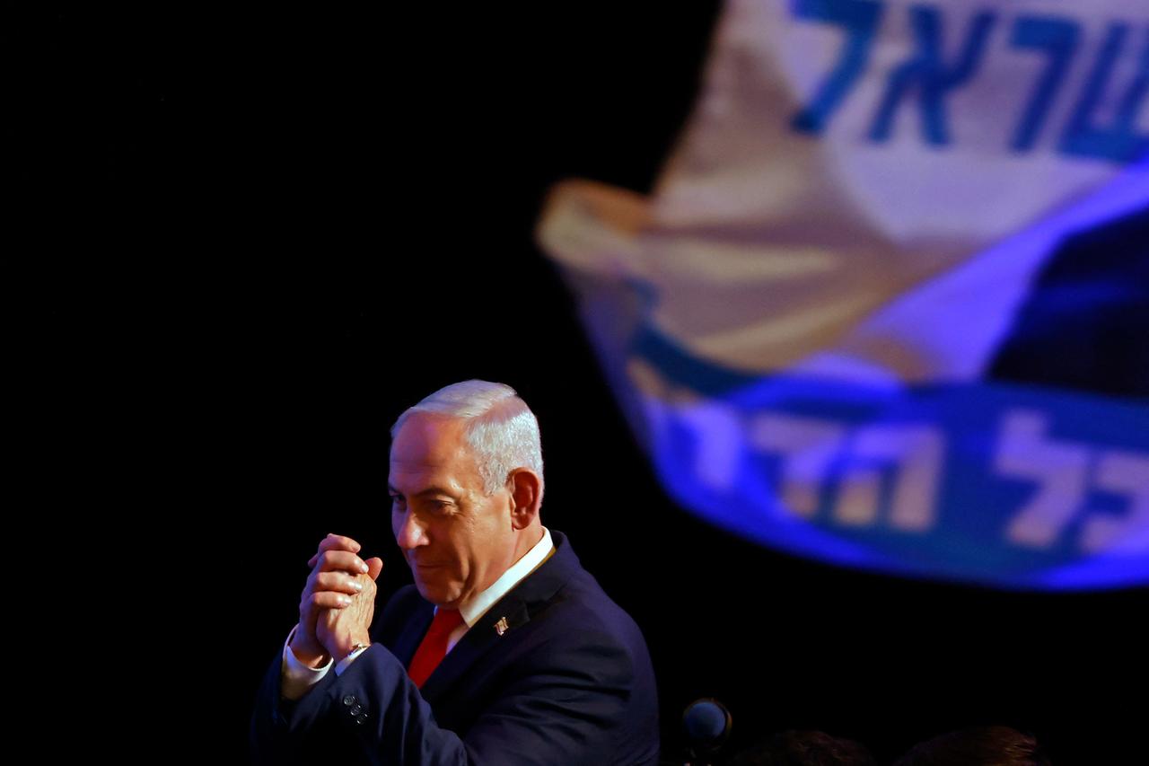Israel's Prime Minister Benjamin Netanyahu gestures to his supporters at the election night rally after the first exit polls were announced, in Jerusalem on early October 28, 2026, during Israel's legislative elections. (AFP Photo)