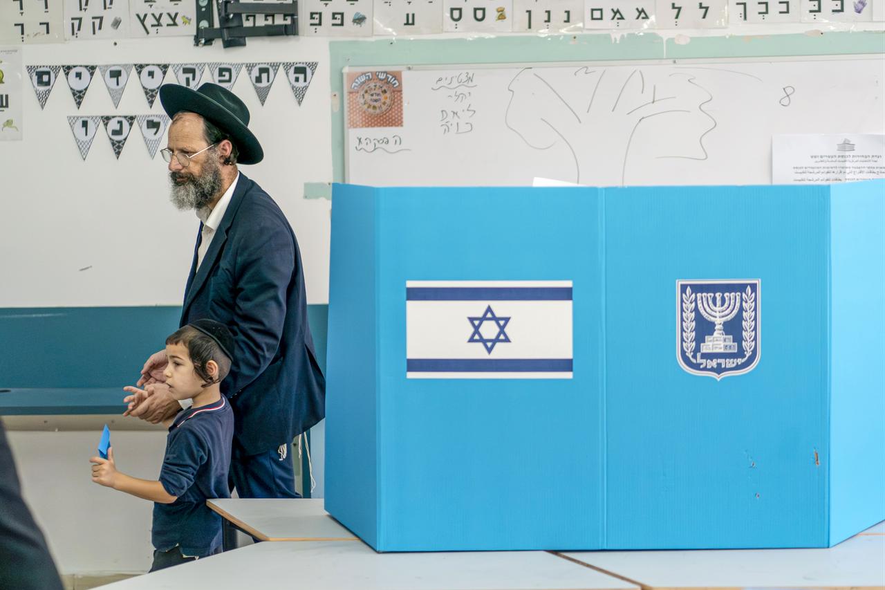 A voter casts a ballot at a polling station in Bnei Brak, near Tel Aviv, Israel, during the general elections on October 27, 2026. (AA Photo)