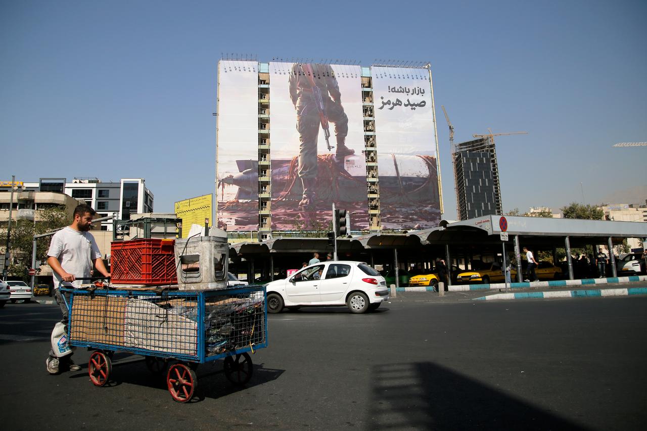A large billboard depicting an armed member of Iran's Islamic Revolutionary Guard Corps (IRGC) standing with one foot on an American REMUS 600 autonomous underwater vehicle (AUV) at Venek Square in central Tehran, Iran, Sept. 28, 2026. (AA Photo)