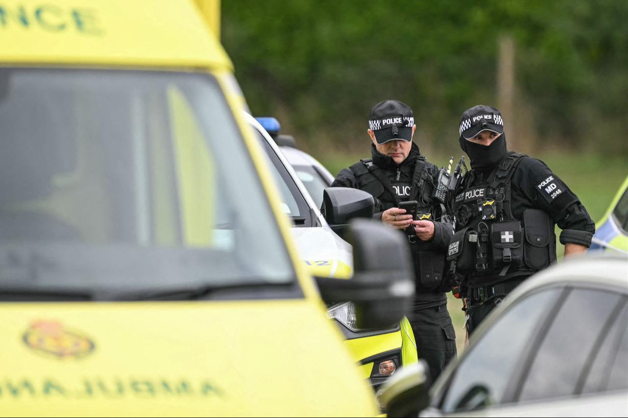 Police are pictured at a base set up at the Fairford Youth Football Club near RAF Fairford base, south-west England on September 27, 2026. (AFP Photo)