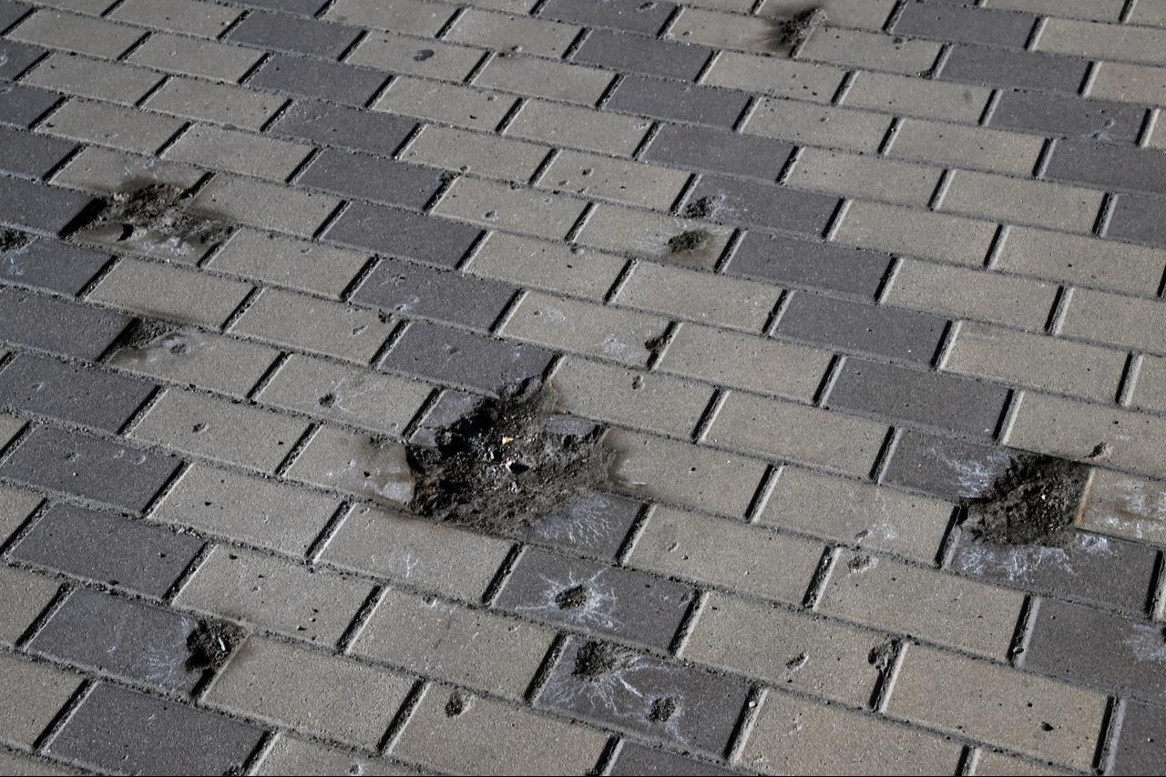 This photograph shows traces of the explosion on a pedestrian way of the bridge following a drone attack on the Northern Bridge in Kyiv on October 3, 2026. (AFP Photo)