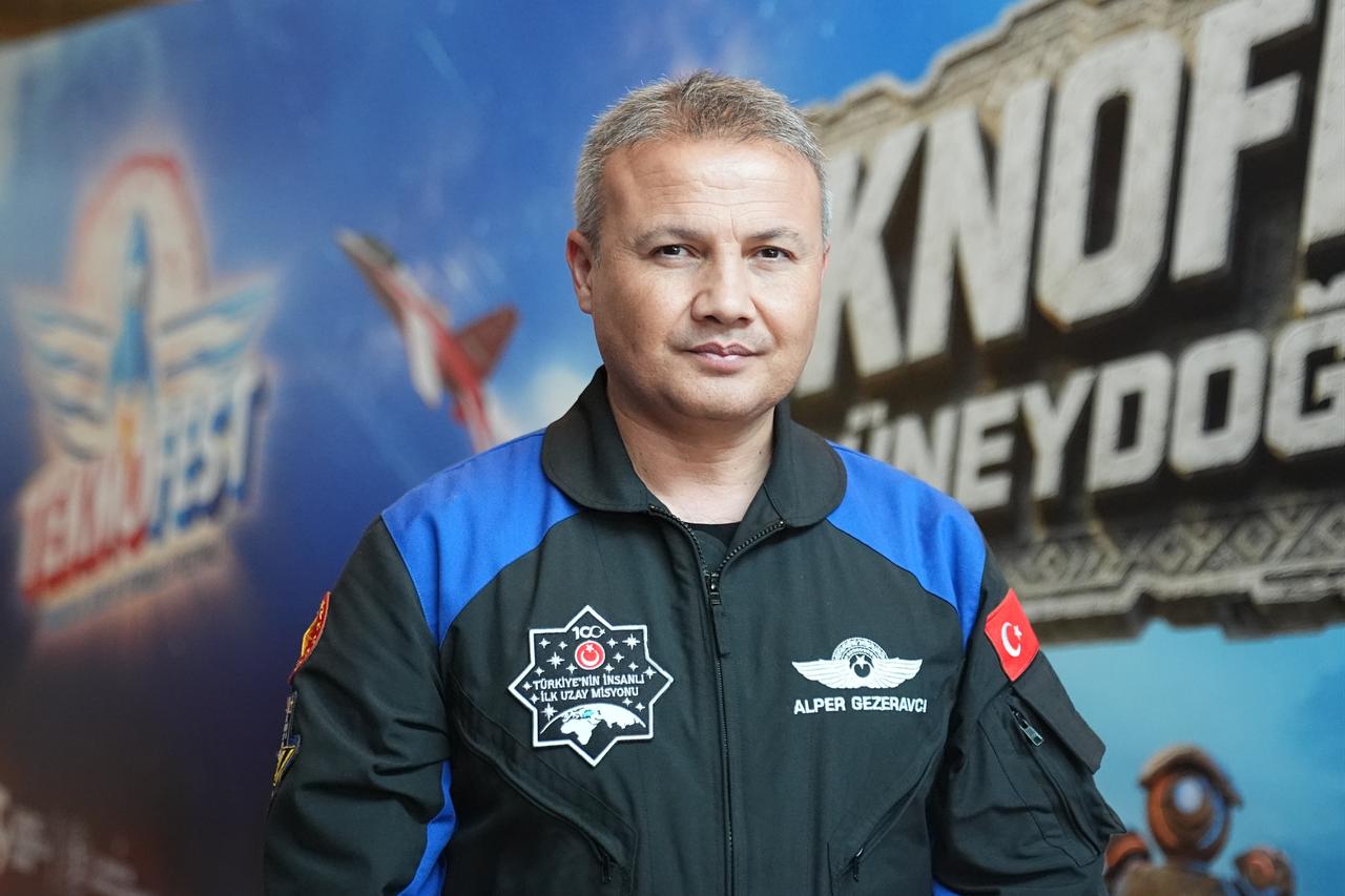 Türkiye's first astronaut, Brig. Gen. Alper Gezeravci, speaks to an Anadolu Agency (AA) correspondent during TEKNOFEST, Türkiye's premier aviation, space and technology festival, at Sanliurfa GAP Airport, Türkiye, Oct. 3, 2026. (AA Photo)