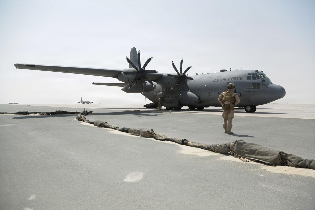 A U.S. Marine oversees a C-130H Hercules preparing to take off after being refueled in the U.S. Central Command area of responsibility, Sept. 10, 2026. (Photo via U.S. Marine Corps)