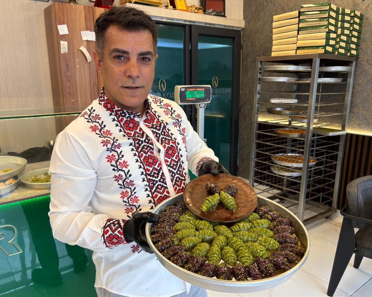 Turkish pastry chef Omer Kozan presents his croissant-shaped baklava, combining French-inspired pastry shapes with traditional Gaziantep flavors, Oct. 28, 2026. (IHA Photo)