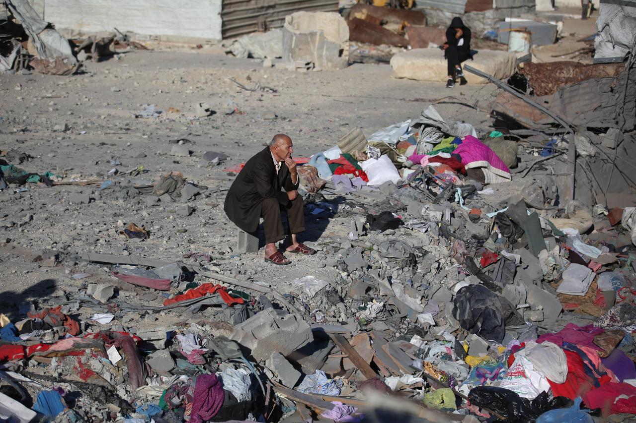 Local Palestinian residents inspect structural damage and inspect the ruins of a residential building targeted by an Israeli airstrike in the Bureij Refugee Camp, central Gaza Strip, Palestine on Oct. 30, 2026. (AA Photo)