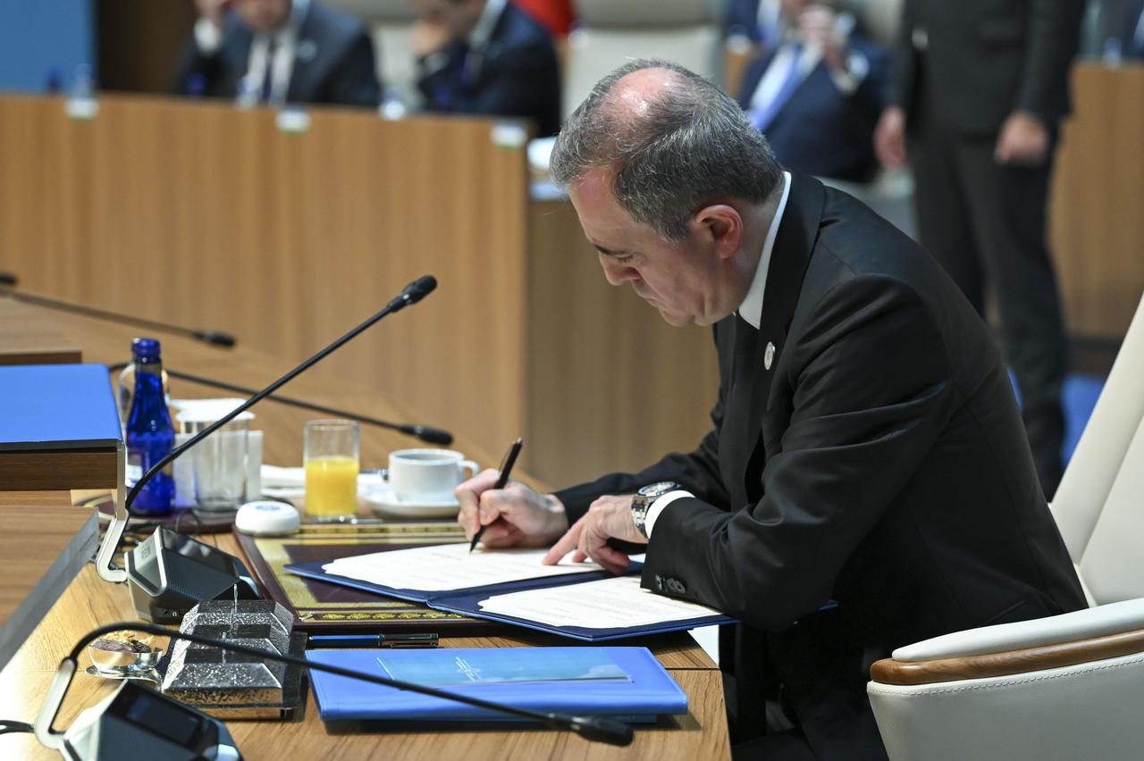 Azerbaijani Foreign Minister Ceyhun Bayramov signs the joint declaration of the 13th Summit of the Council of Heads of State of the Organization of Turkic States (OTS) at the Bestepe Nation’s Exhibition Hall in Ankara, Türkiye on Friday, Oct. 30, 2026. (AA Photo)