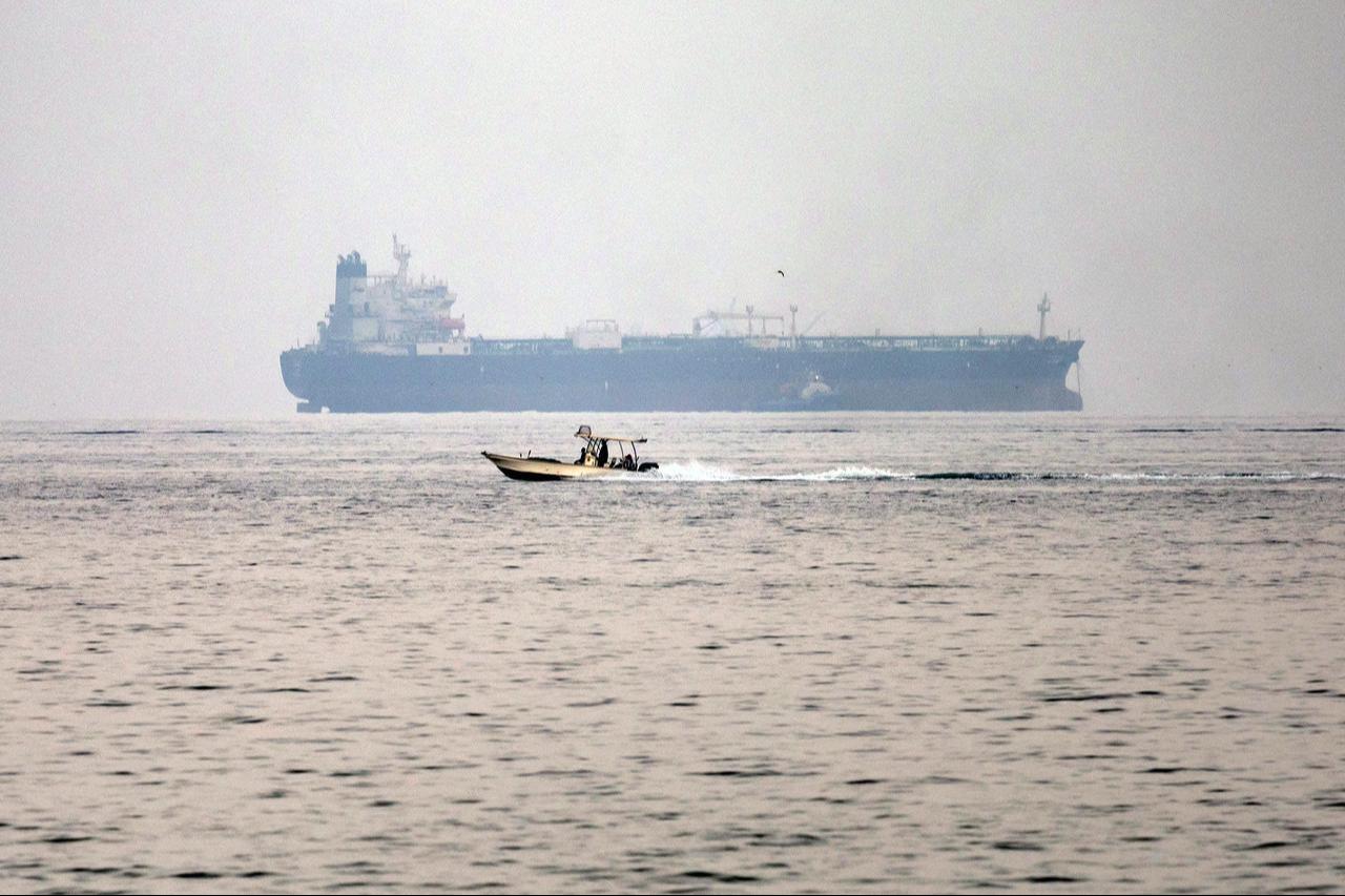 A vessel transits the Gulf of Oman off the coast of Khor Fakkan in the emirate of Sharjah in the east of the UAE on October 13, 2026. (AFP Photo)