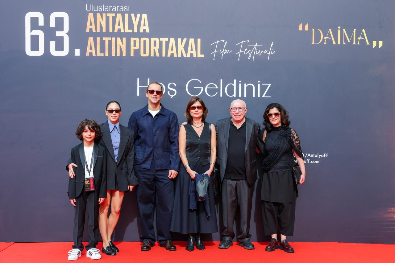The cast and crew of "What Remains," including director Yesim Ustaoglu and actors Oyku Karayel and Metin Akdulger, pose at the 63rd International Antalya Golden Orange Film Festival in Antalya, Türkiye, October 2026. (Photo via 63rd International Antalya Golden Orange Film Festival)