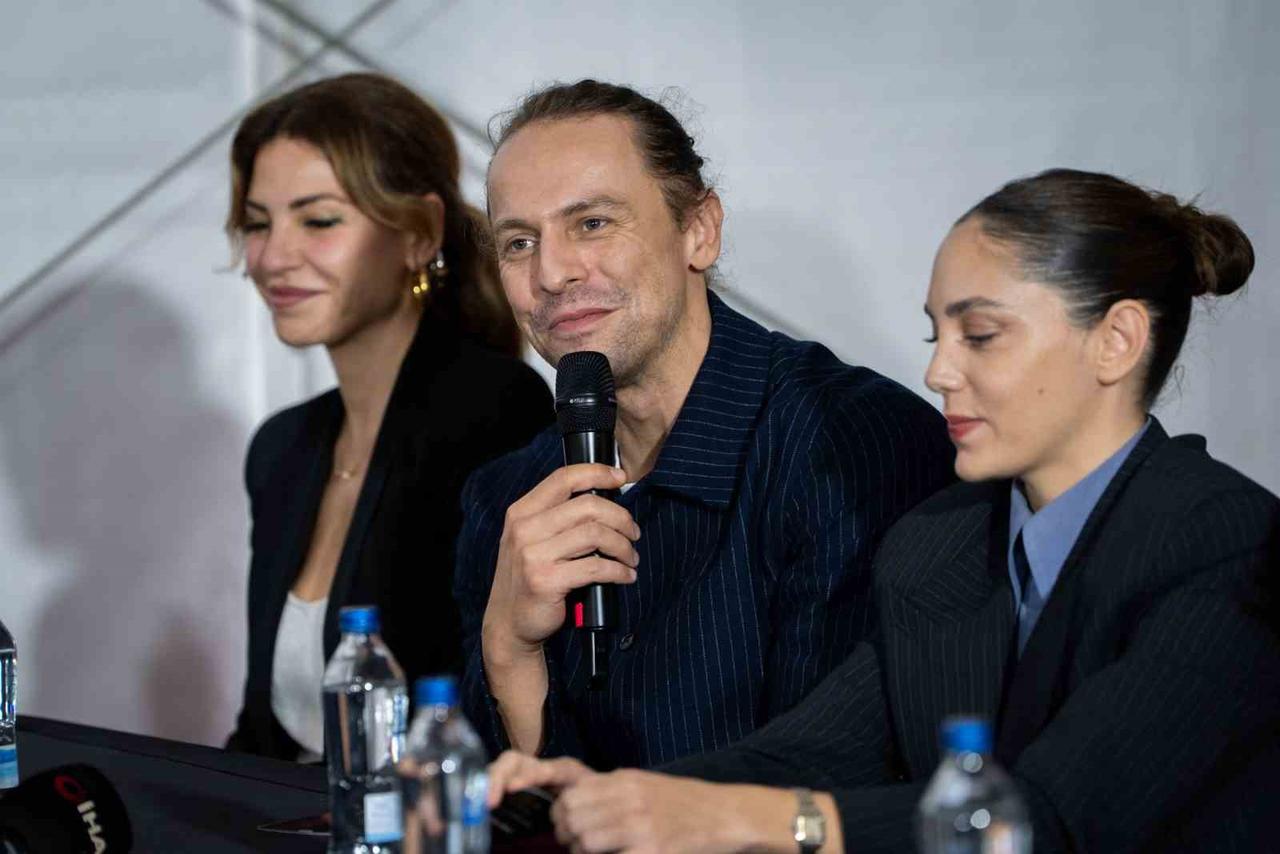 Actor Metin Akdulger speaks during a press conference for "What Remains," alongside fellow actress Oyku Karayel, at the 63rd International Antalya Golden Orange Film Festival in Antalya, Türkiye, October 2026. (IHA Photo)