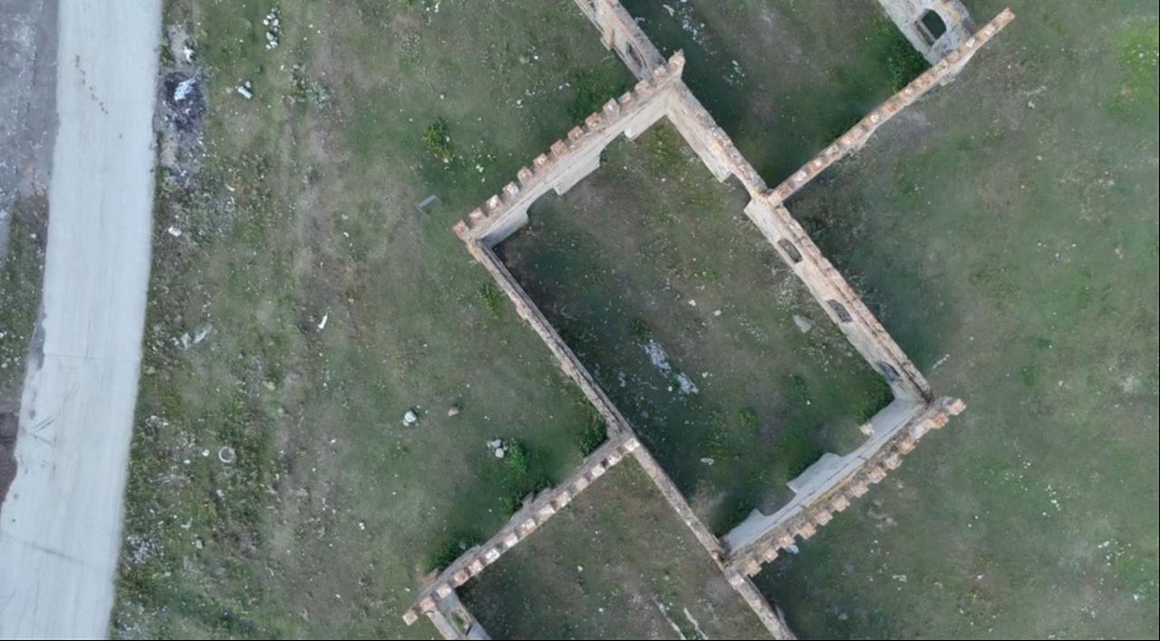 A drone photograph highlights the maze-like layout, arched doorways and deteriorating stone walls of the historic Cer Workshops in Sarikamis, Türkiye. (IHA Photo)