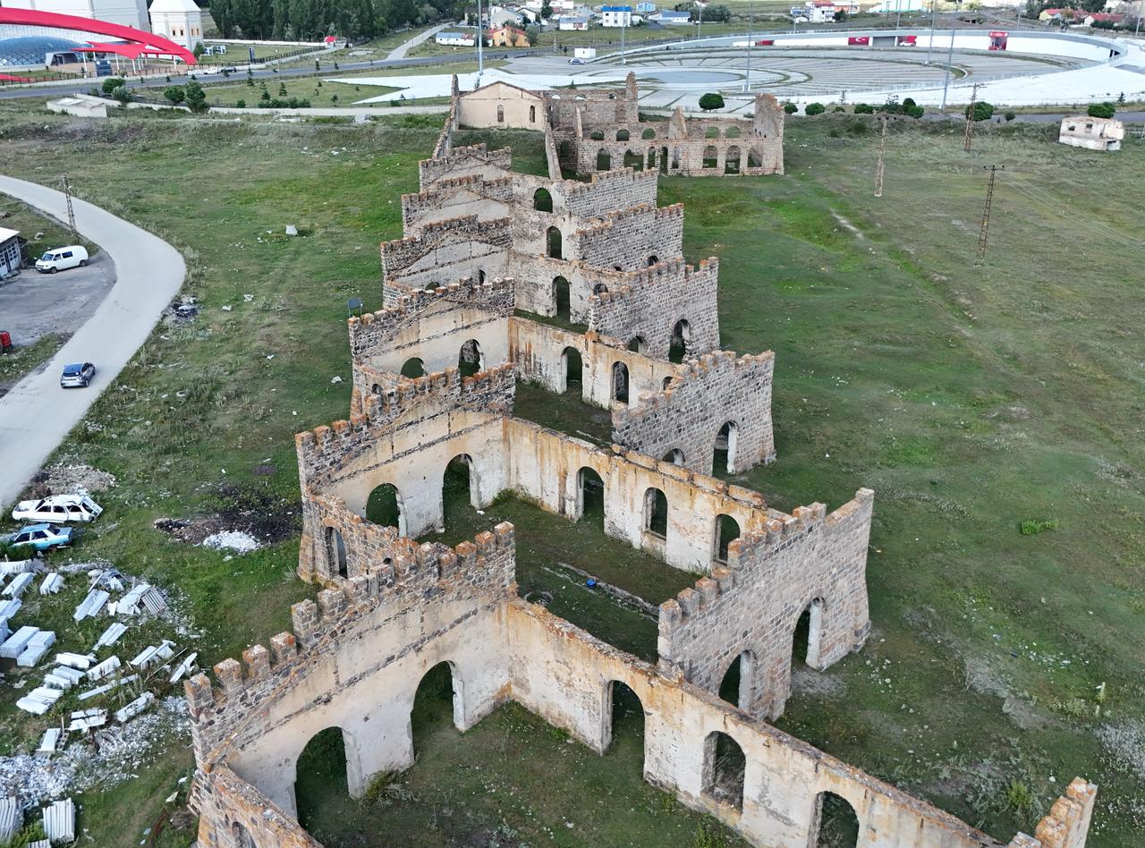 A drone photograph highlights the maze-like layout, arched doorways and deteriorating stone walls of the historic Cer Workshops in Sarikamis, Türkiye. (IHA Photo)