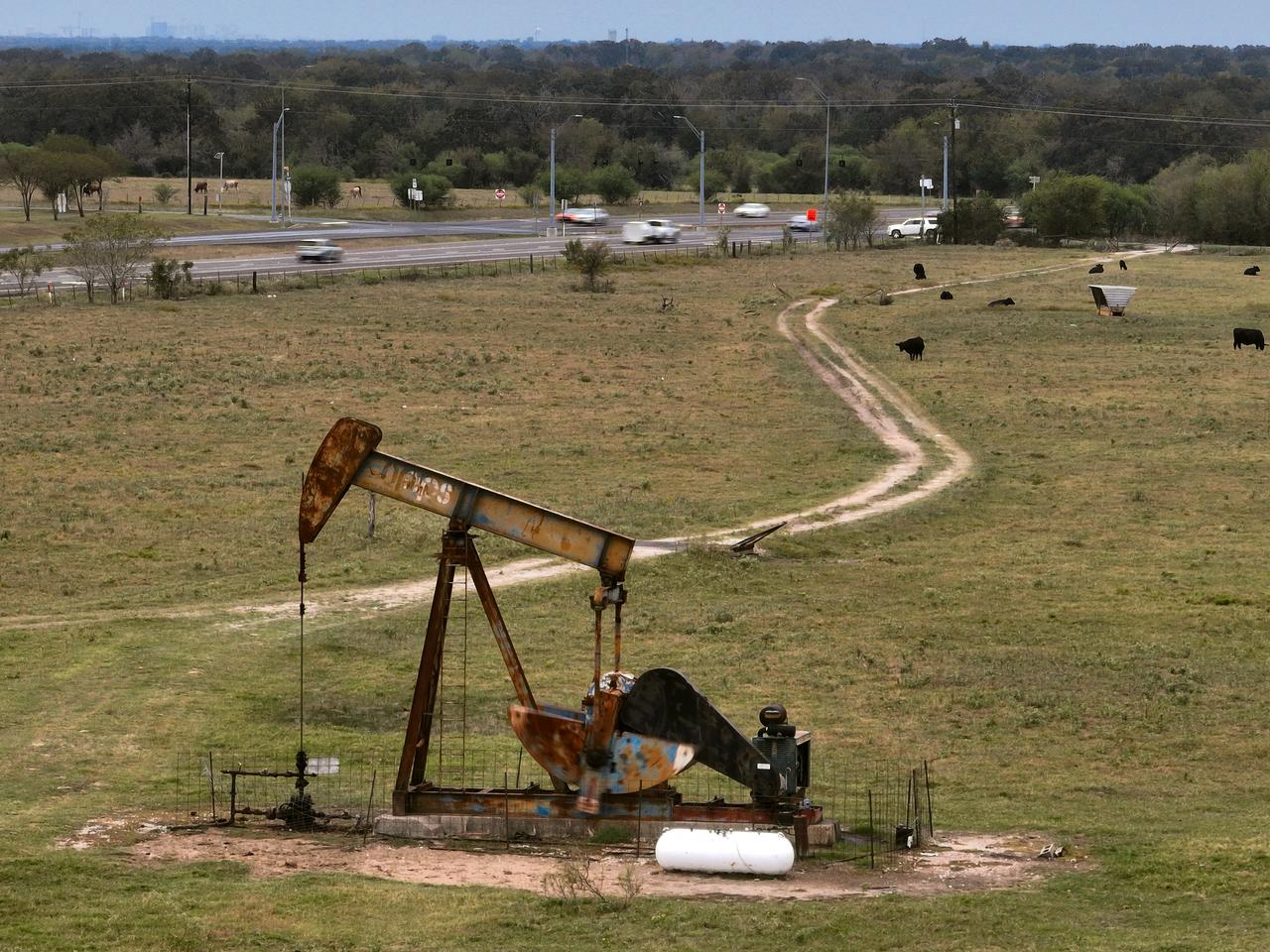 In this aerial view a pumpjack pulls up oil along State Highway 190 on October 30, 2026 in Bryan, Texas. (AFP Photo)