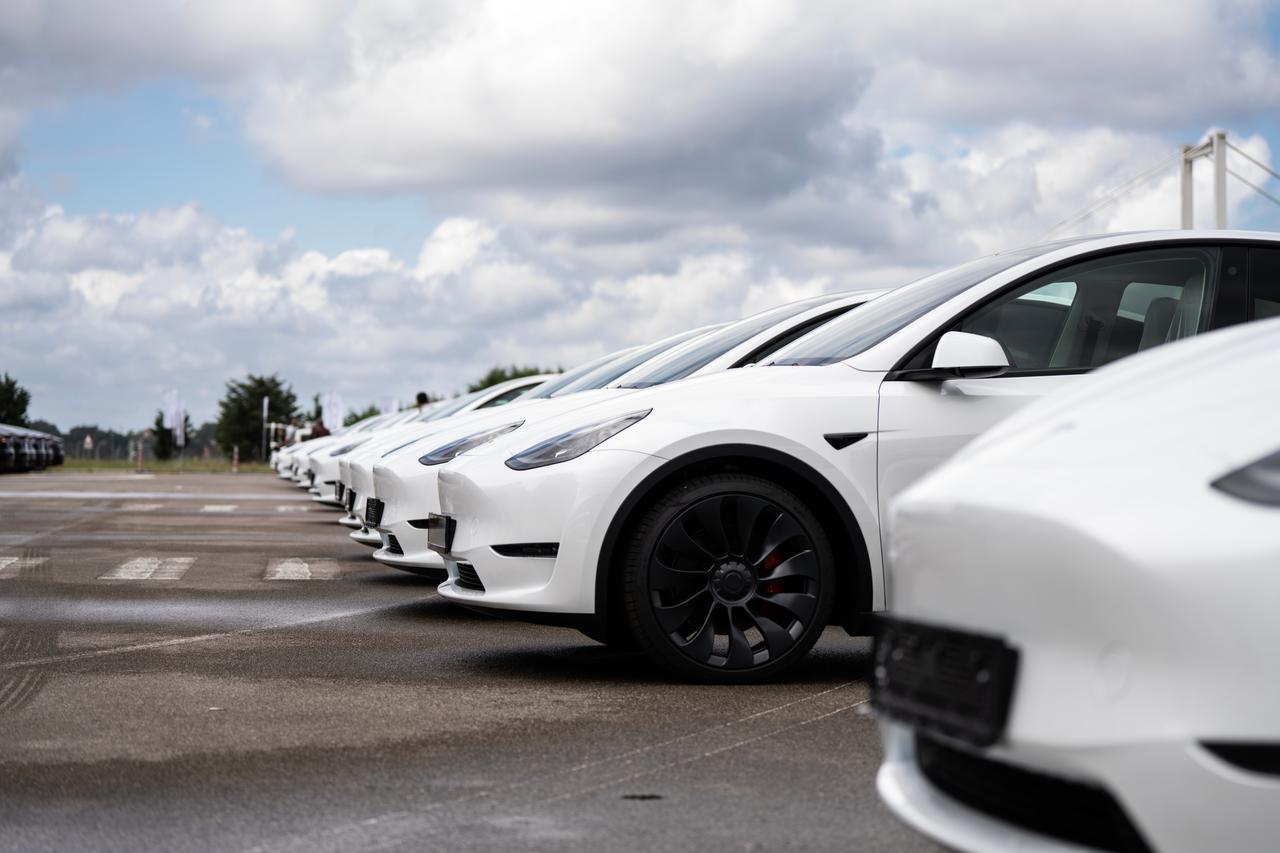 New white Tesla Model Y cars are lined up at a delivery center in Istanbul, Türkiye, June 12, 2023. (Adobe Stock Photo)