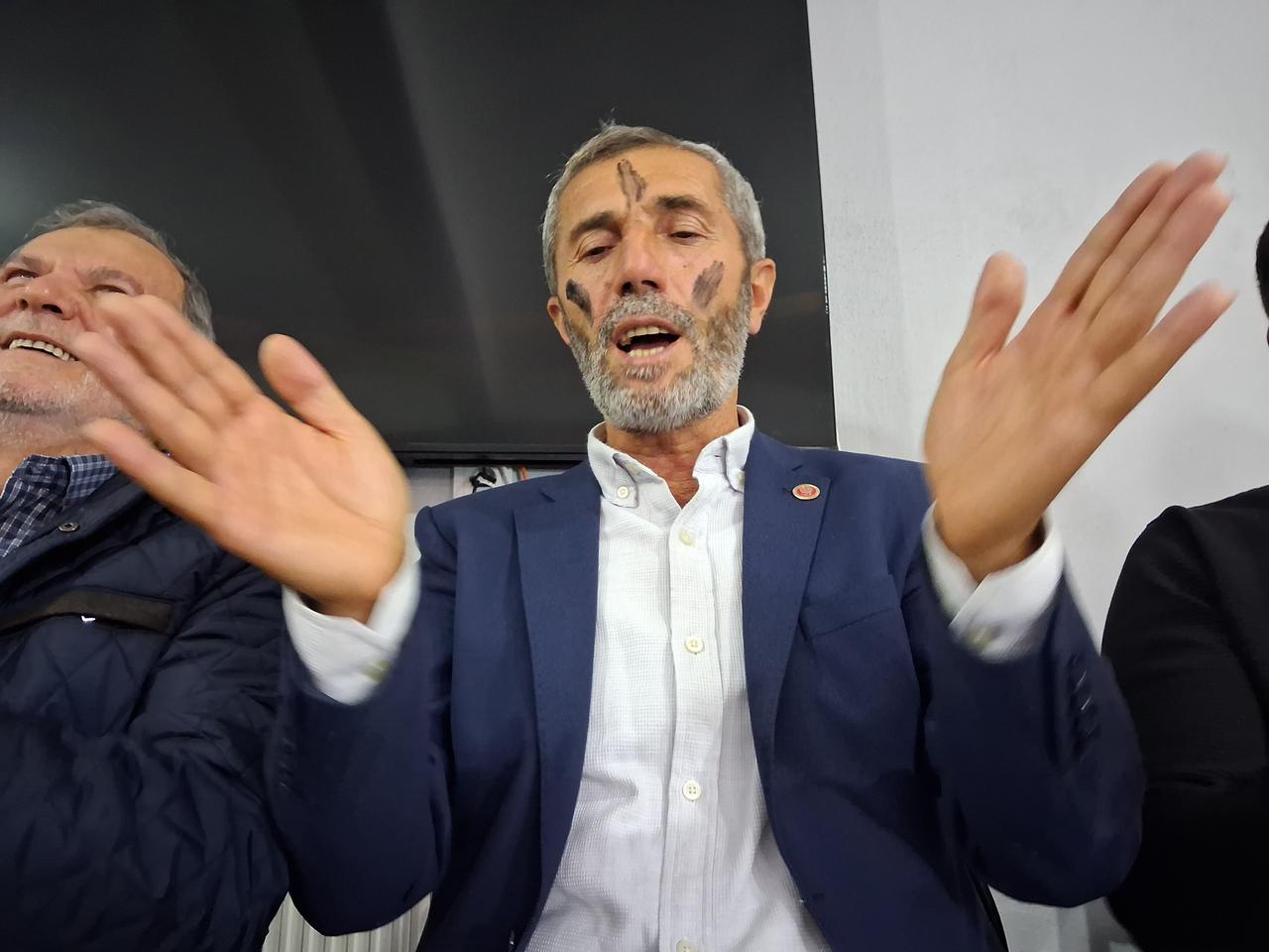 A participant with black marks on his face claps while playing the traditional Karacik game in Akcapinar neighborhood, Tarakli, Sakarya, Türkiye, Oct. 4, 2026. (AA Photo)