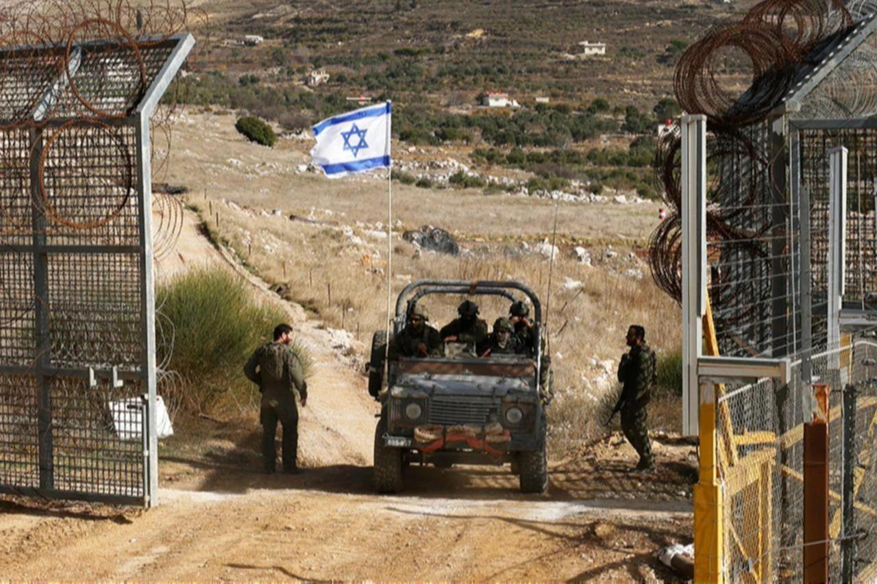 An Israeli military vehicle crosses the fence as they return from buffer zone with Syria, near Druze village of Majdal Shams in Israel-annexed Golan Heights, Dec. 10, 2024. (AFP Photo)