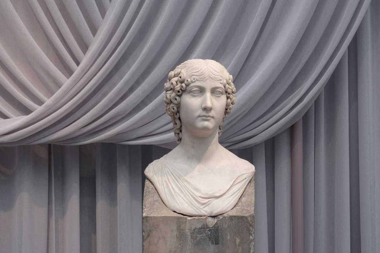 A Roman-era marble bust is displayed as part of "The Power of Fashion in the Roman Empire" exhibition at the Glyptotek Museum in Copenhagen, Denmark. (Photo via Türkiye's Ministry of Culture and Tourism)