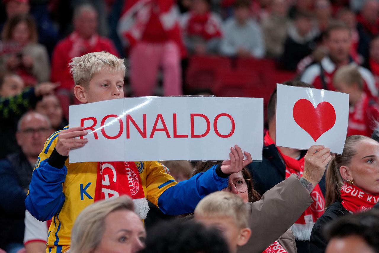 Supporters hold a sign reading “Ronaldo” and a heart during the UEFA Nations League match between Denmark and Portugal at Parken Stadium in Copenhagen, Denmark, Oct. 1, 2026. (AFP Photo)