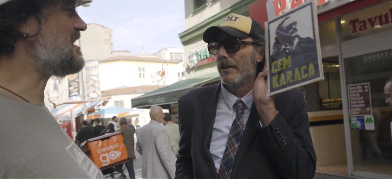 Mathias Mlekuz and Philippe Rebbot explore a busy Istanbul street in a scene from "A Bicyclette!." (Image via M.E.S. Productions, F Comme Film)