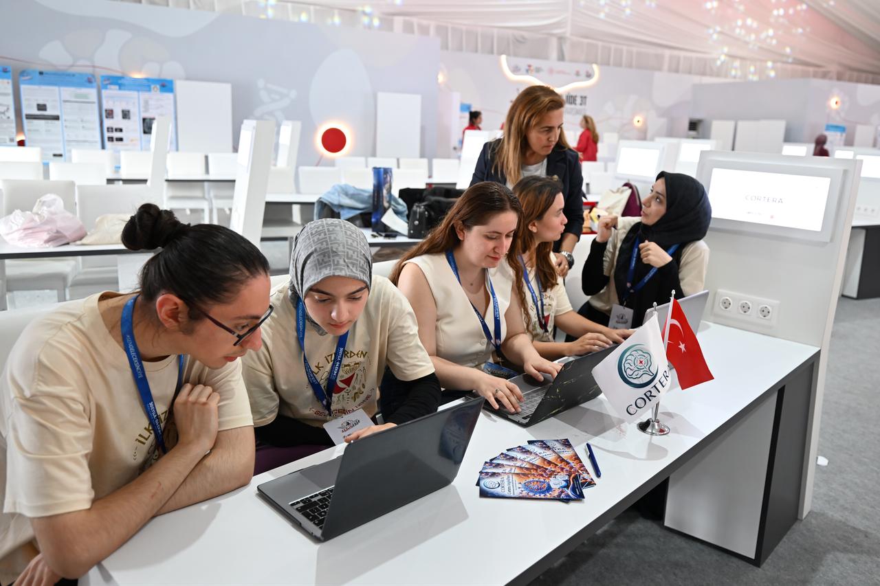 Cortera Team members work on their laptops during the Onkolojide 3T competition at TEKNOFEST 2026 in Sanlıurfa, Türkiye, Oct. 4, 2026. (AA Photo)