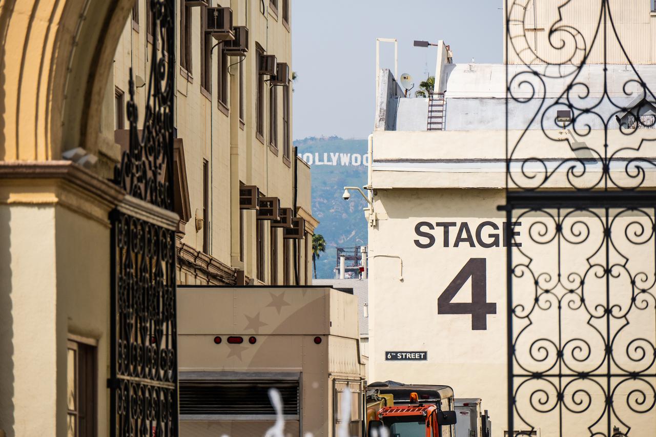 Stage 4 at the Paramount Pictures studio lot is seen with the Hollywood sign in the background in Los Angeles, California. (Adobe Stock Photo)