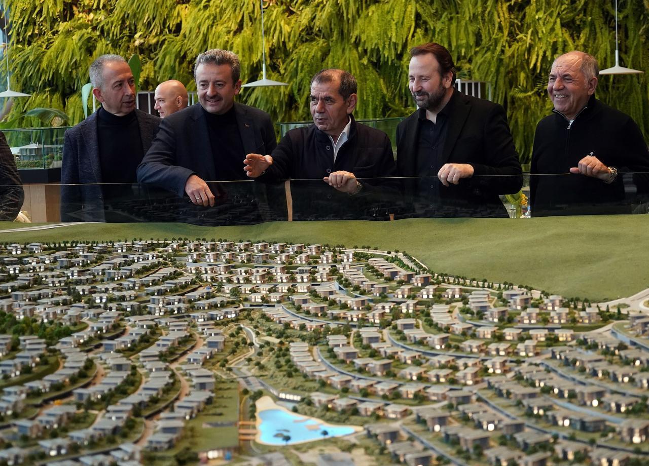 Galatasaray President Dursun Ozbek and club officials look at a model of the Dreams Valley (Dusler Vadisi) residential project in Riva, Istanbul, March 19, 2023. (IHA Photo)
