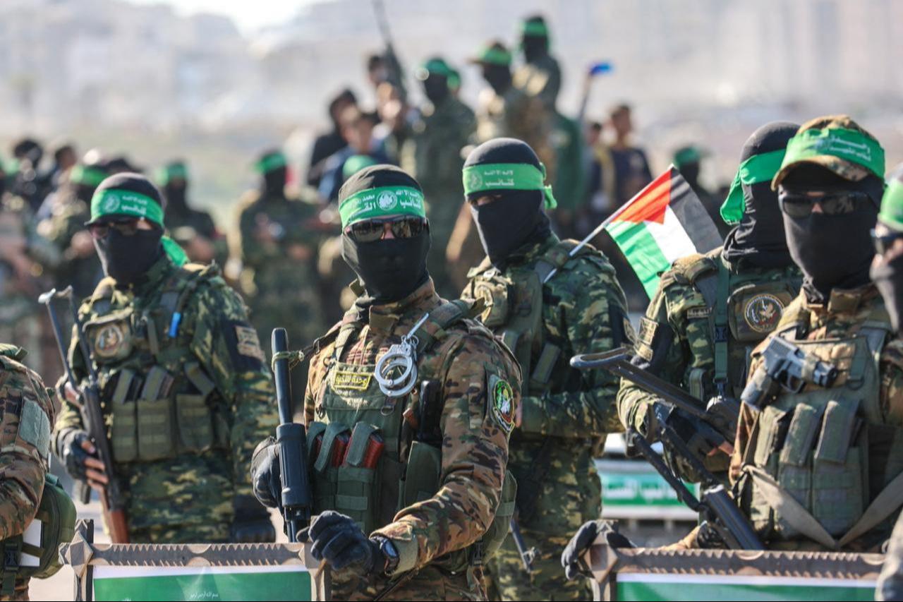 Hamas members secure an area before handing over an Israeli-America hostage to a Red Cross team in Gaza City, February 1, 2025. (AFP Photo)