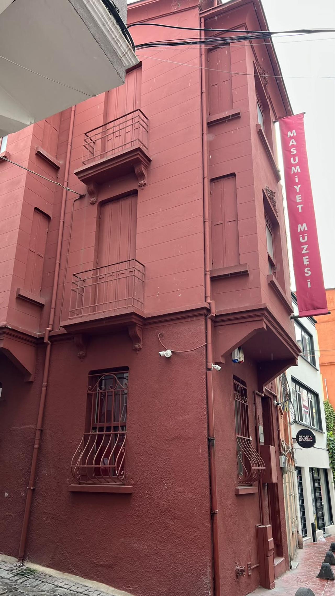 The Museum of Innocence’s deep red facade rises above the narrow street outside. (Photo by Nour Dajani)