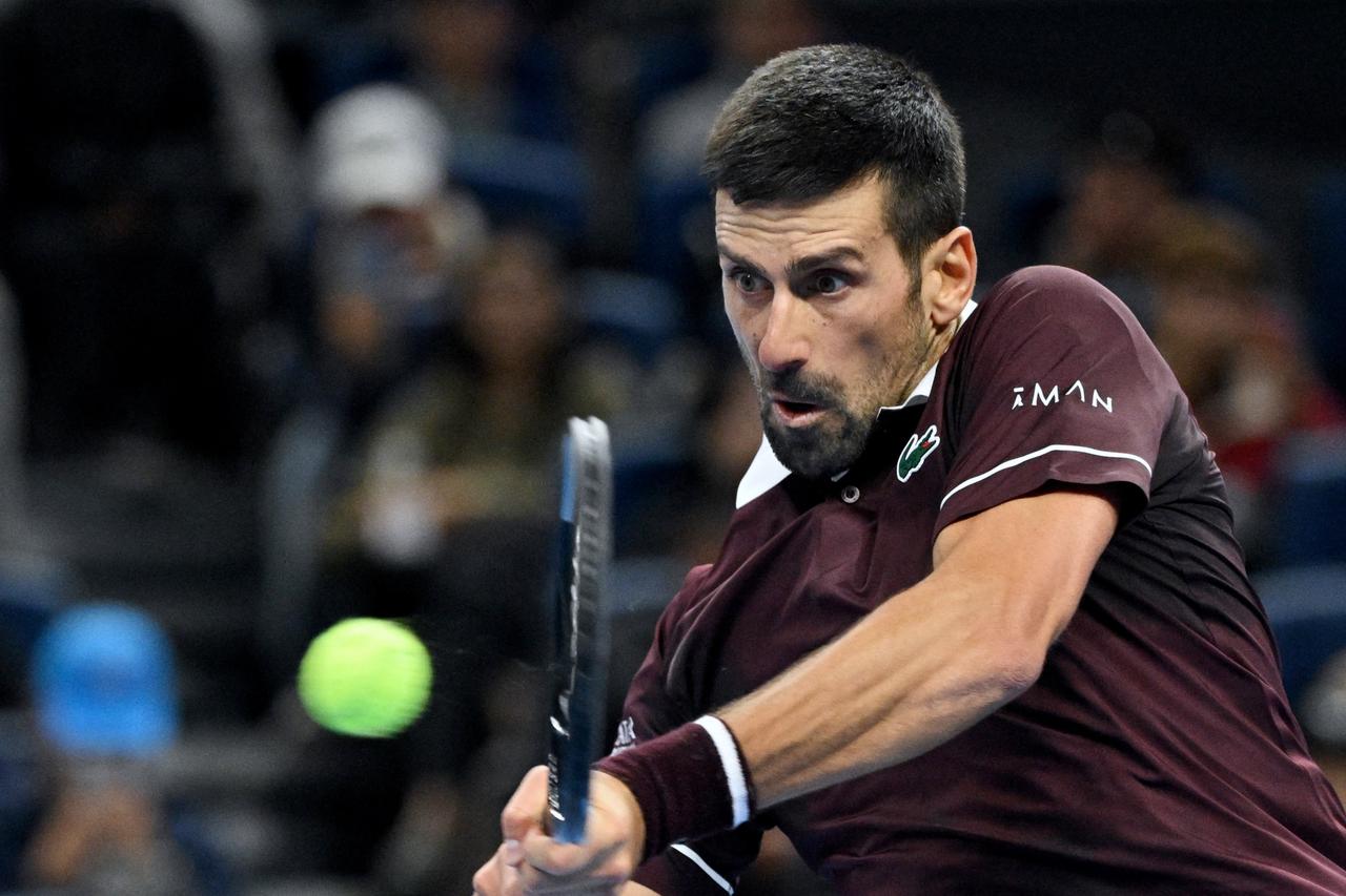 Djokovic reaches Beijing final after Medvedev is defaulted