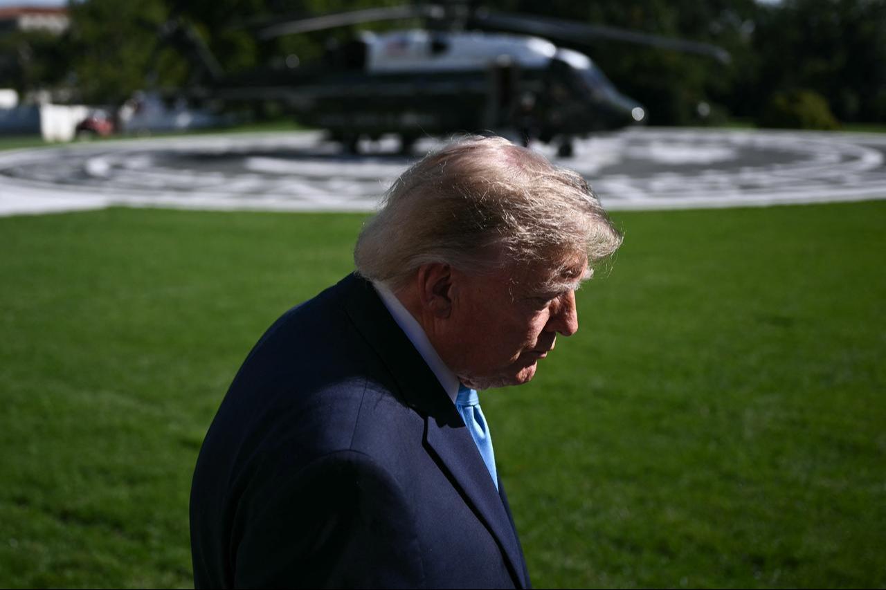 US President Donald Trump talks to the media before boarding Marine One as he departs from the South Lawn of the White House in Washington, DC, October 5, 2026. (AFP Photo)